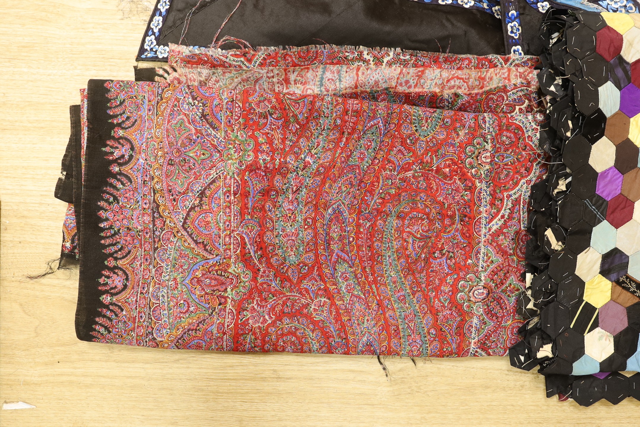 A Chinese silk robe, a 19th century patchwork panel and a panel from a Paisley summer shawl and a black parasol